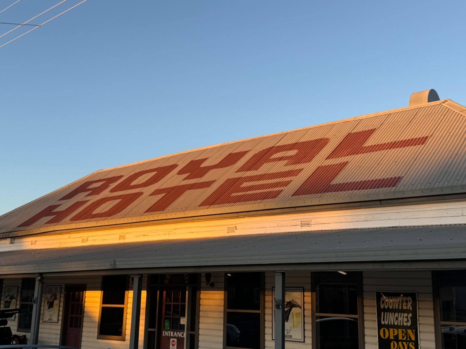 Royal Hotel Narromine, with ROYAL HOTEL painted across the roof. Photograph by Cory Loves Beer.